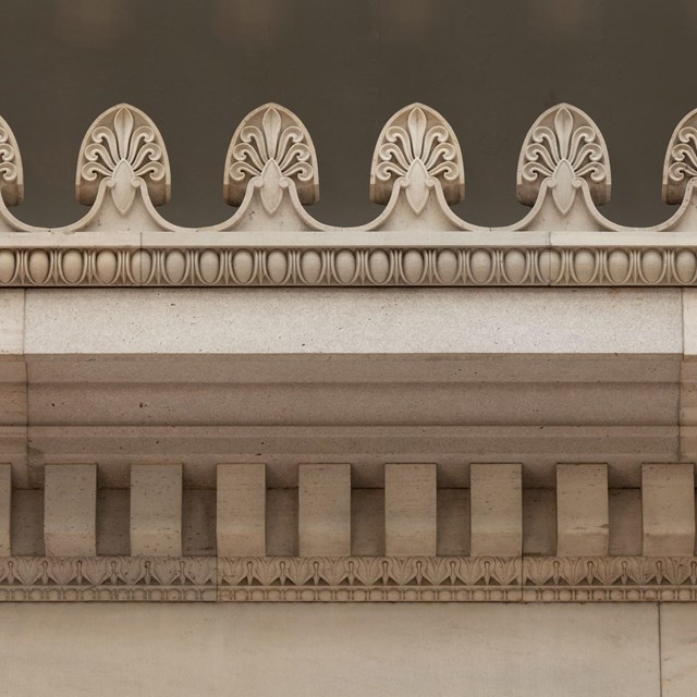 U.S. Custom House in New Orleans, Louisiana - detail of white molding on olive colored wall